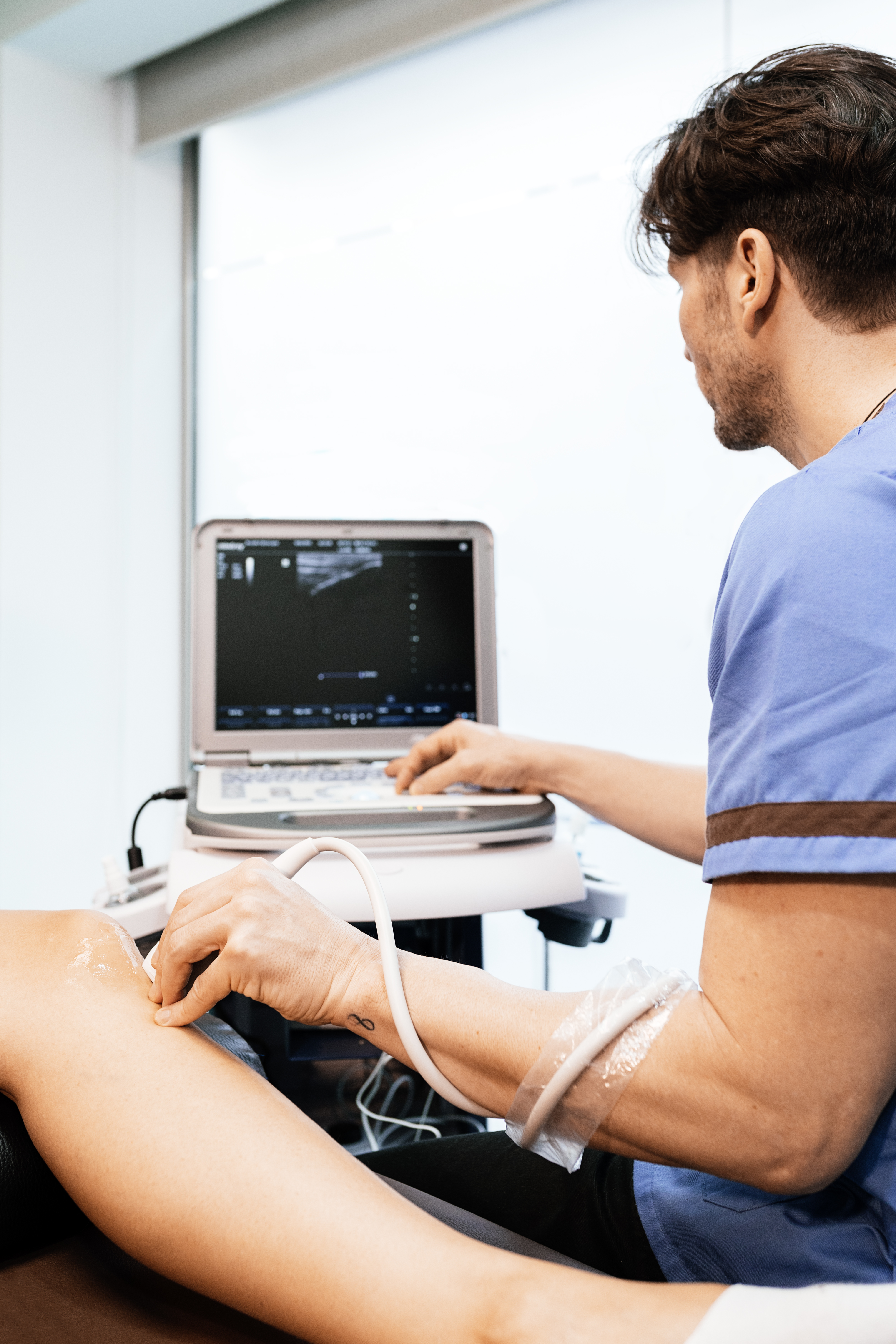 Physiotherapist giving knee therapy to a woman